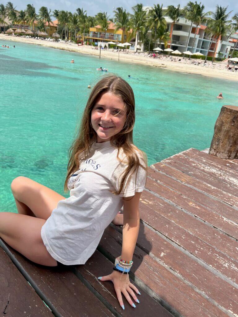 Teen girl getting ready to snorkel in Cozumel Mexico.