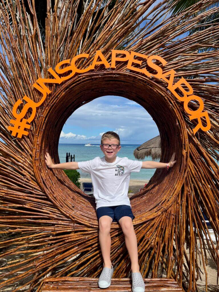 Young boy enjoying trip to Sunscape Sabor in Cozumel Mexico